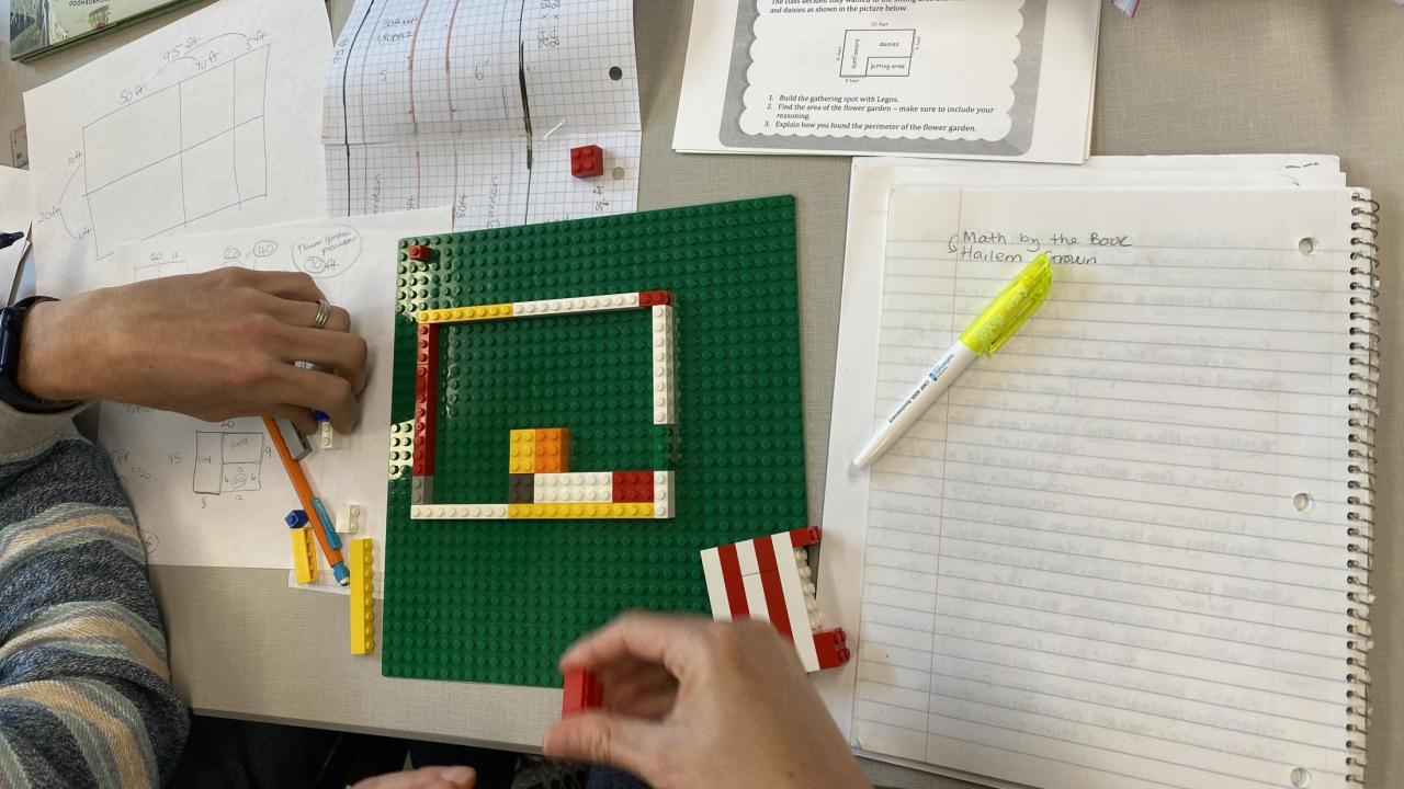 participants working with legos to solve a math problem